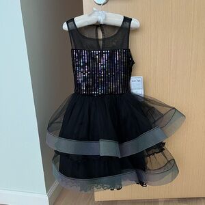 Black sleeveless dress with tulle skirt and sequin and velvet bodice, size 7.